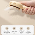 FuzzleJoy Self-Cleaning Grooming Brush collecting loose fur, one-click hair removal